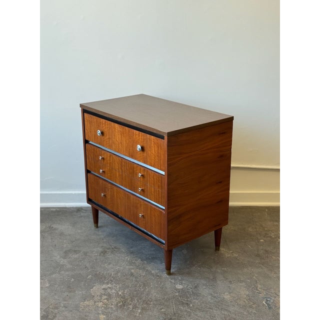 We are pleased to present this lovely mid-century modern small chest of drawers, which has been fully restored to its...