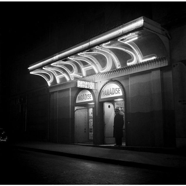 Paris At Night PARIS FRANCE - NOVEMBER 1: Exterior of the Paradise nightclub with the doorman out front on November 1 1948...