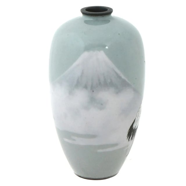 An antique Japanese, late Meiji period, Silver wire and enamel vase. The urn shaped vase has a narrow fluted neck. The...