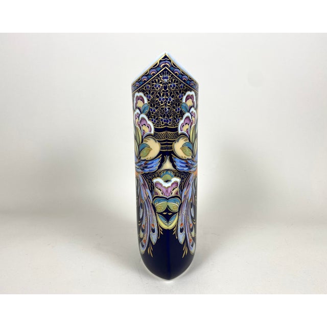 Vintage collectible vase with a peacock-like fantasy bird from the one of most famous porcelain manufactory in germany...