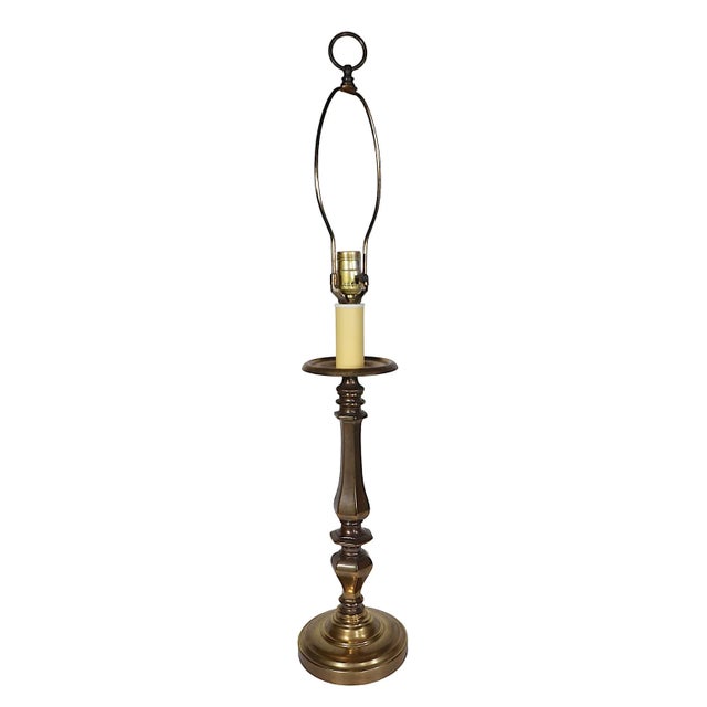 Classic brass candlestick lamp in very good, clean, and working condition. The lamp is well made, heavy and impressive....