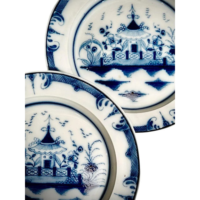 A pair of 1800s English pearlware Chinese style, blue and white octagon shape plates. old descriptions on back from a...