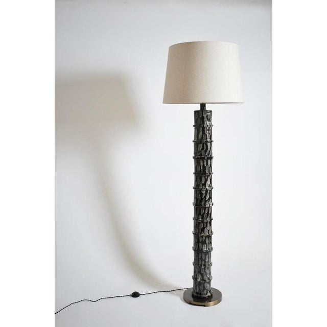 "Inle" grey and black ceramic floor lamp, Barracuda edition. Height: 42 cm - 16.54 in Diameter: 20 cm - 7.87 in Up to 250V...