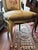 Painted French side chair with a serpentine carved crest and apron picked out in gilt, cabriole legs, and a cartouche-...