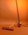 Stilnovo design floor lamp, an original from the 1960s. Its base consists of a golden ball that supports the lamp's...
