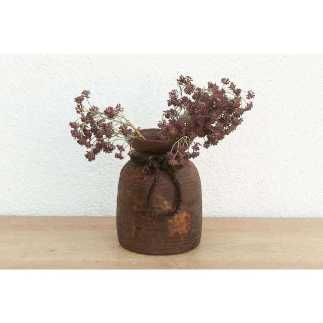 Originally used in village homes for storing milk, ghee, or grains, this antique wooden pot has survived generations of...