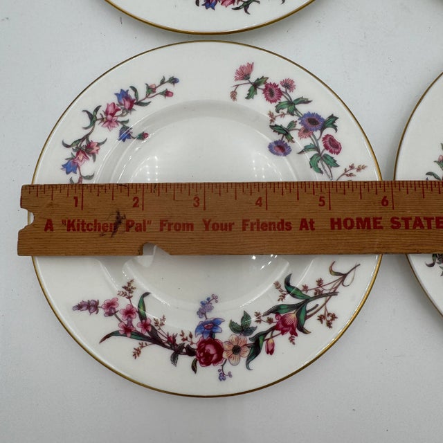 Wedgwoods Devon Sprays is a graceful dinnerware pattern accented with blue & pink flowers, long stems, and leaves. With...