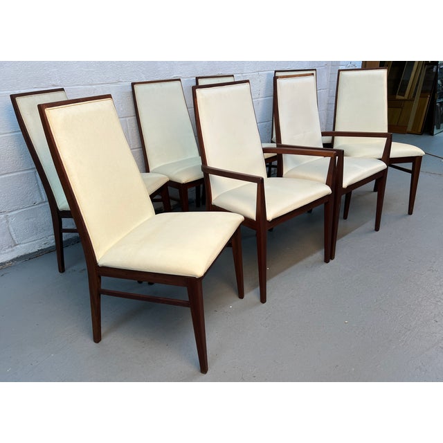 Elevate your dining space with these exceptional set of (8) Merton Gershun for Dillingham “Esprit” Mid-Century Walnut...