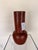 Contemporary decorative sculpture crafted from terracotta, featuring a rich earthy glazed finish and a bold, organic...