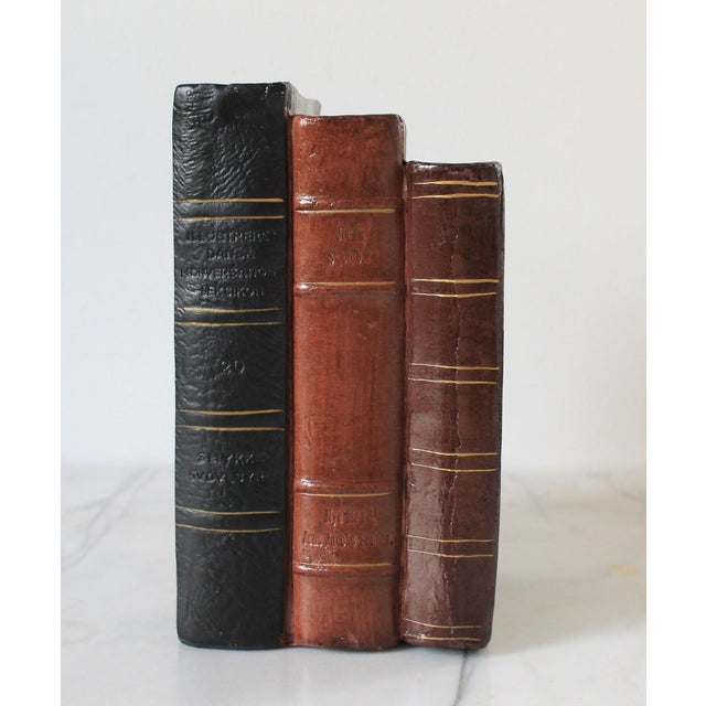Vintage faux leather books single bookend. No makers mark. Light age wear.