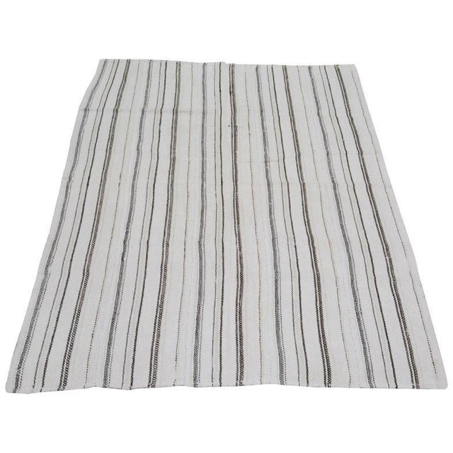Hand-knotted with care using traditional rug-making techniques, this wool rug blends timeless craftsmanship with a modern...