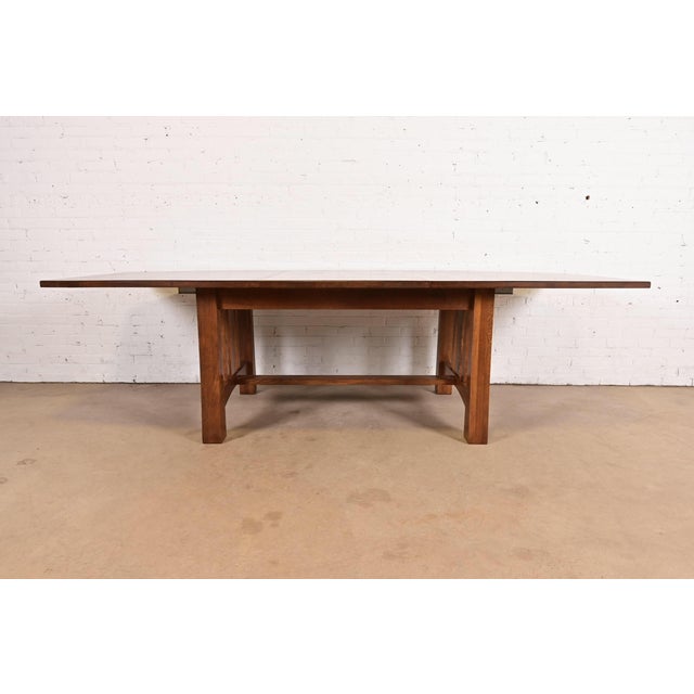 An exceptional Mission or Arts & Crafts style quarter sawn oak extension dining table In the manner of Stickley USA, Circa...