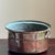 Offering a small antique tinned copper pot with three heavy-duty ring handles. Historically used for everyday cooking,...