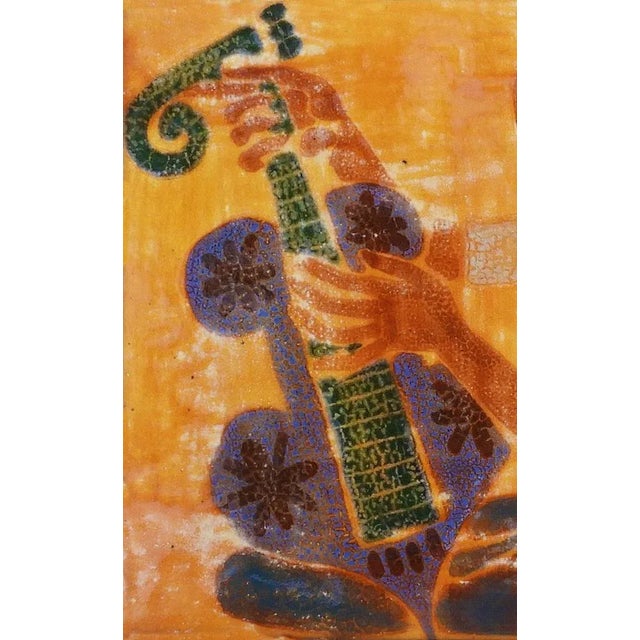 Girl Playing Guitar' Mid-Century Ceramic Wall Art C1950. Hand-painted, textured ceramic with strong colours and a high...