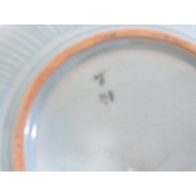 This handcrafted Korean vase is signed in calligraphy on the underside.
