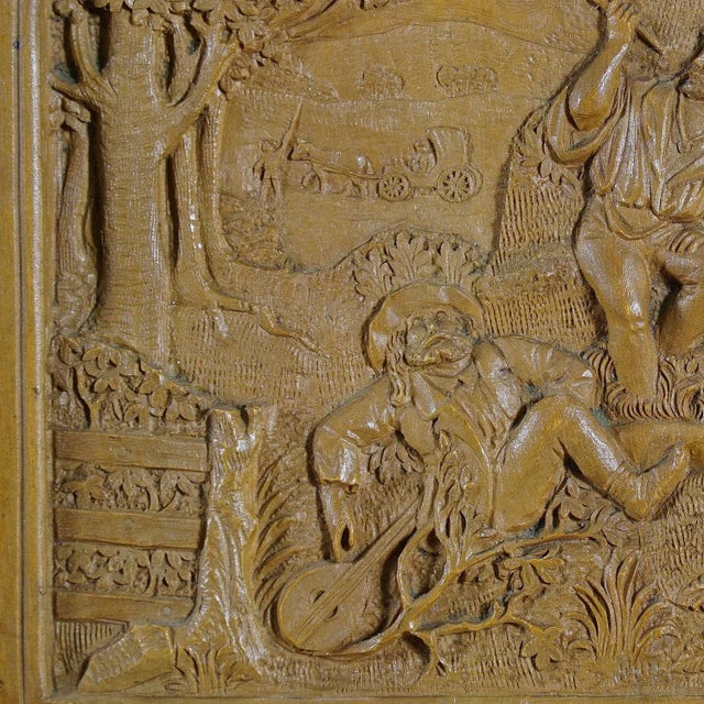 A small wall plaque with detailed relief carvings worked out of linden wood by Johann Rint, circa 1880. Probably depicting...