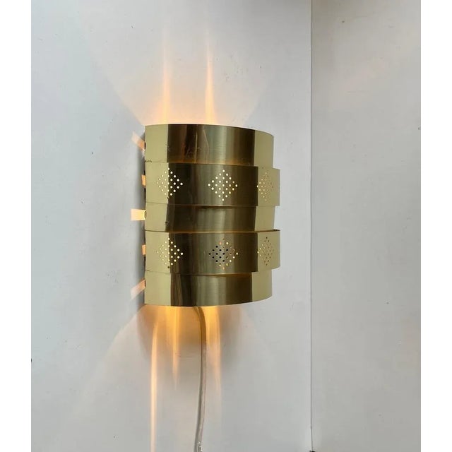 Sculptural Wall lamp designed by Werner Schou and manufactured by Coronell Elektro in Denmark during the early 1970s. Its'...
