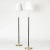Pair of elegant floor lamps from Falkenbergs Belysning, made from brass. Sleek stems dressed with black leather,...