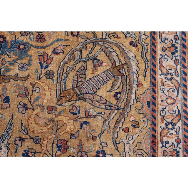 This Persian Tabriz rug showcases the exquisite craftsmanship and intricate artistry typical of master weavers from...