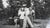 Mid 20th century snapshot photograph of party girls holding a strawman. Unframed, corner bumps.