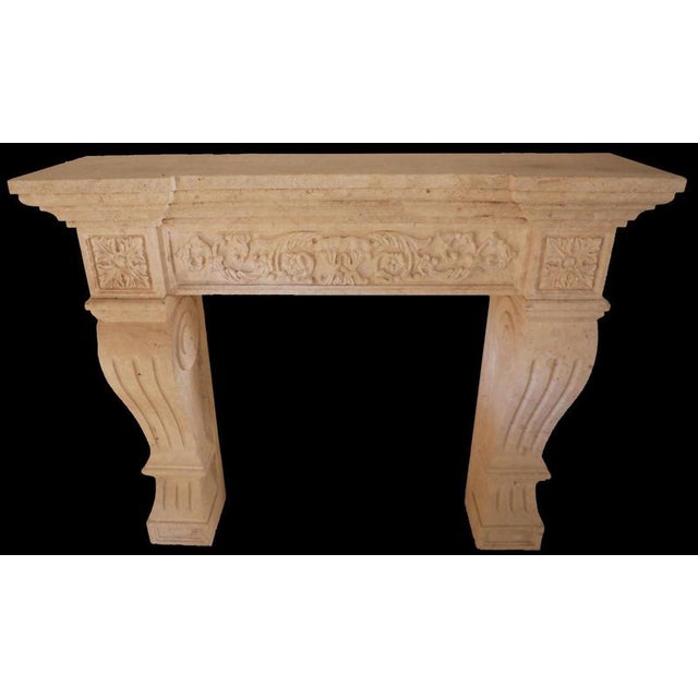 A beautifully sculpted limestone fireplace from France, dating to the 20th century, this mantel boasts elegant...