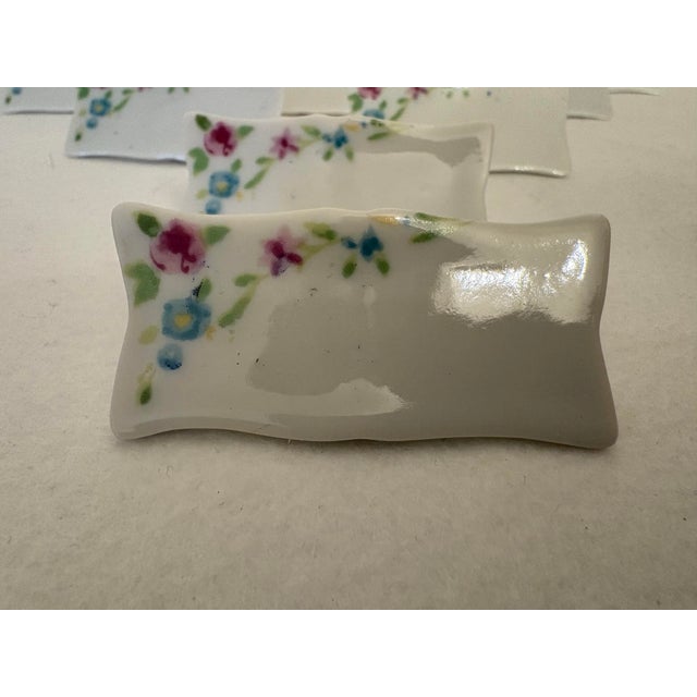 Vintage write on-wipe off place card holders are perfectly matched in this set of 11 mid-century tableware accessories...