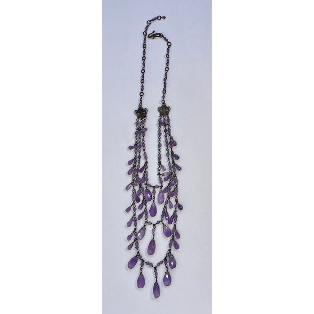 This necklace with its faceted amethyst tear drop shaped stones is from the Ralph Lauren 2010 Heiress Collection. The...