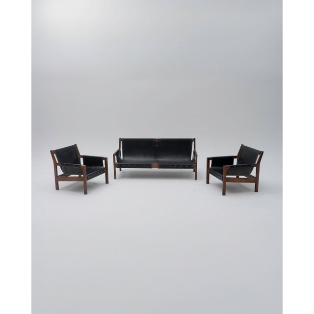 A Brutalist-style sofa and two armchairs, designed in the 1960s and attributed to Paco Muñoz for the prestigious Spanish...