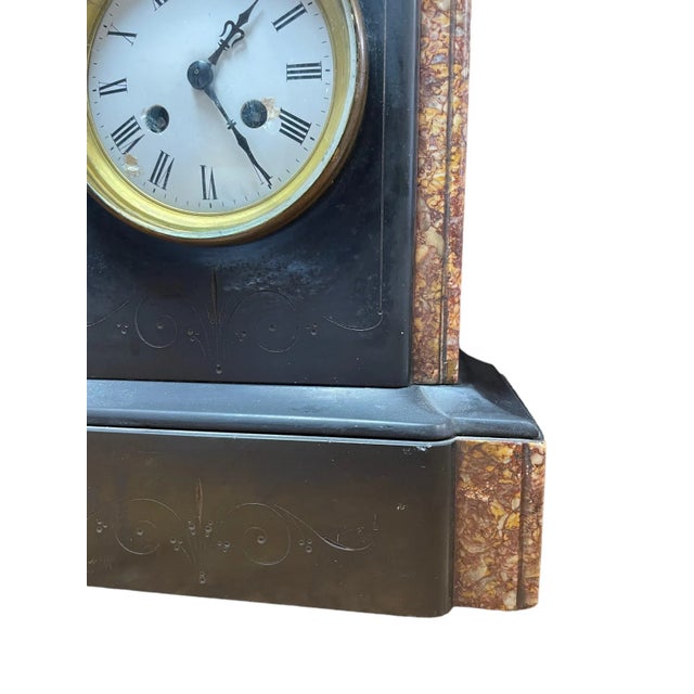 A stunning Antique slate with marble details mantel clock. Chairish sells electronic items only with the display as the...