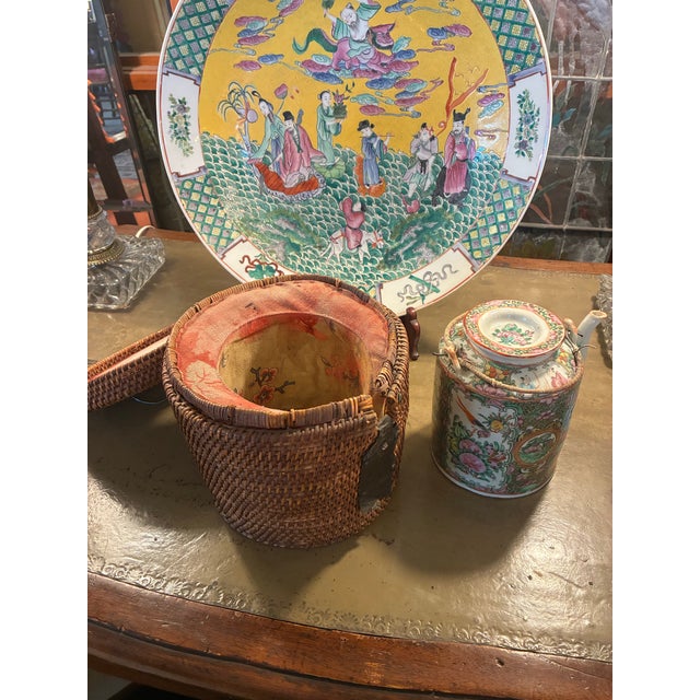 Antique Qing Dynasty Chinese Famille Rose Medallion Porcelain Teapot in its original fitted woven bamboo basket, often...
