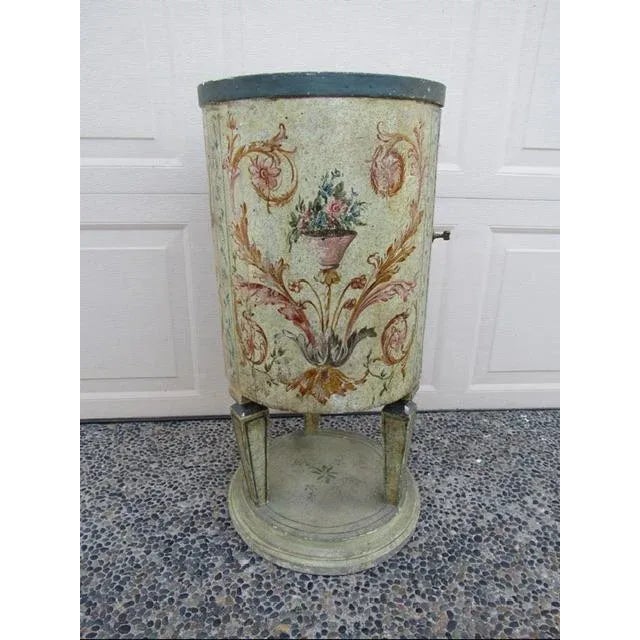 Antique Italian painted drum table, c.1800 Circular in shape with a cupboard door which opens to a single shelf interior...