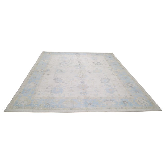 Hand-knotted with care using traditional rug-making techniques, this wool rug blends timeless craftsmanship with a modern...