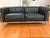 A rare opportunity to acquire a complete, authenticated Cassina LC3 Grand Confort suite — two two-seat sofas and two...