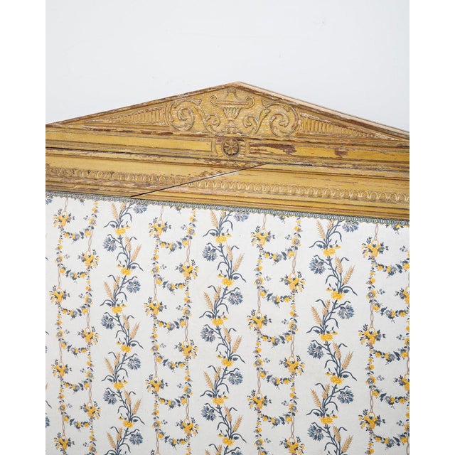 A charming and dreamy french hand-carved bed frame in a soft mustard yellow finish, featuring elegant floral cotton...