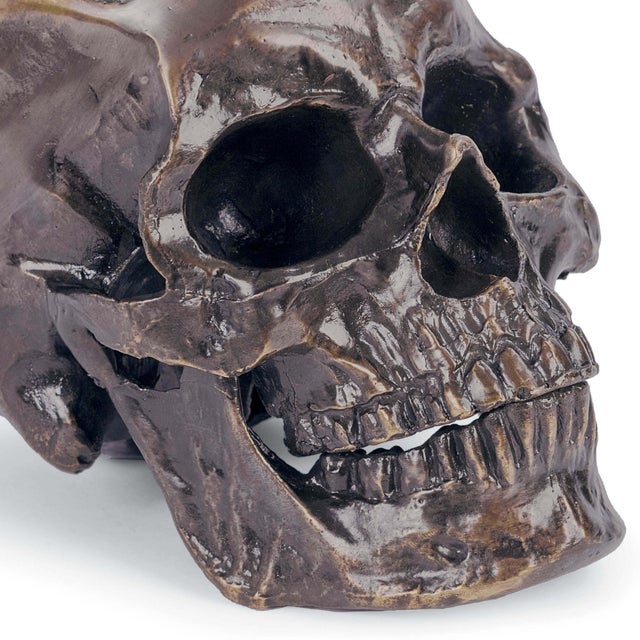 This skull tabletop accessory, finished in bronze, looks edgy and glam as a bookend or decorating a side table in your...
