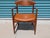 Authentic Ib Kofod-Larsen armchair for Selig, circa 1950s. Beautifully refinished teak frame paired with a rich cognac...
