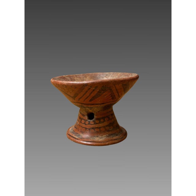 Terracotta cup, colima culture, mexico, 100 bc - 250 ad brown terracotta with a glossy red slip, painted with geometric...