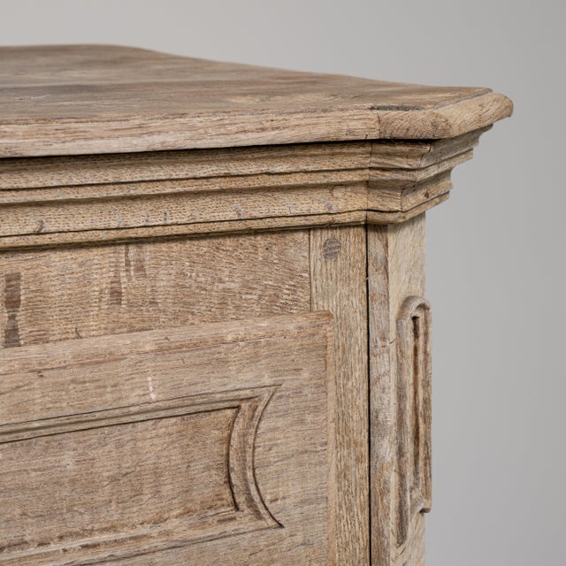 A distinguished example of early 19th-century French craftsmanship, this solid oak buffet embodies the restrained elegance...
