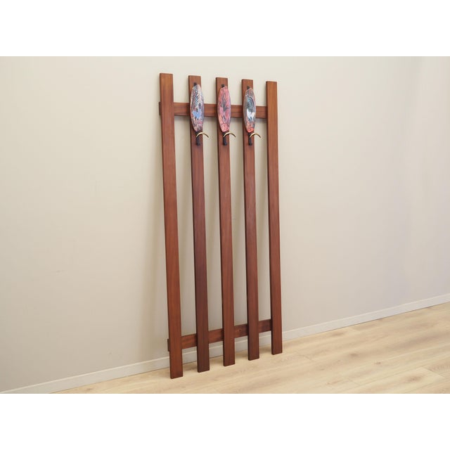 The hanger was made in the 1970s, Danish production. The structure was made of teak. The minimalist form adds an original...