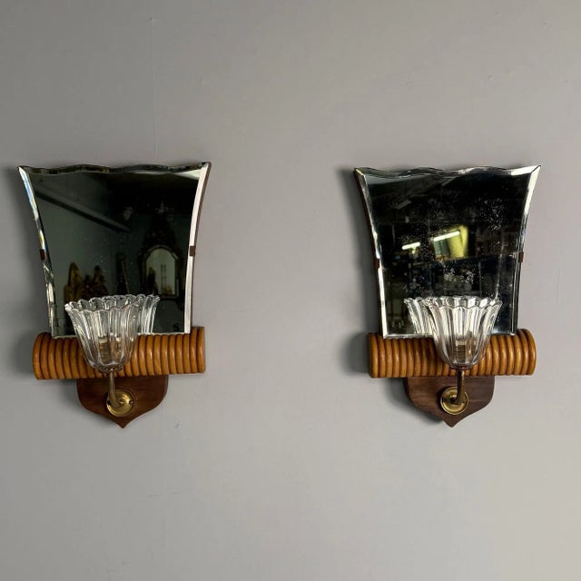 Italian Mid-Century Modern, Mirrored Wall Sconces or Wall Lights, Brass, Wood, Italy, 1940s This stunning pair of Italian...
