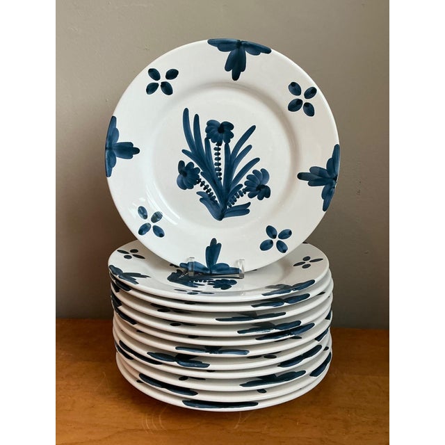 A set of 12 vintage hand-painted ceramic dinner plates by Penny Morrison, showcasing her signature aesthetic with vibrant...