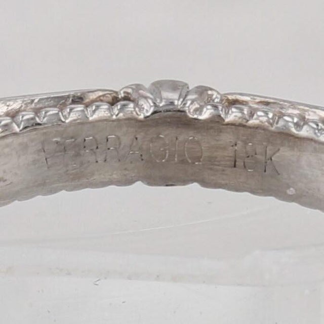 This lovely vintage inspired engagement ring comes with inner and outer Veraggio boxes as well as a paper copy of the GIA...