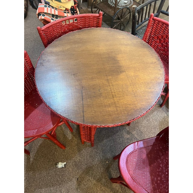 This is a Rare HeyWood Wakefield Wicker painted red petite dining set with 4 chairs. This set was originally not red...