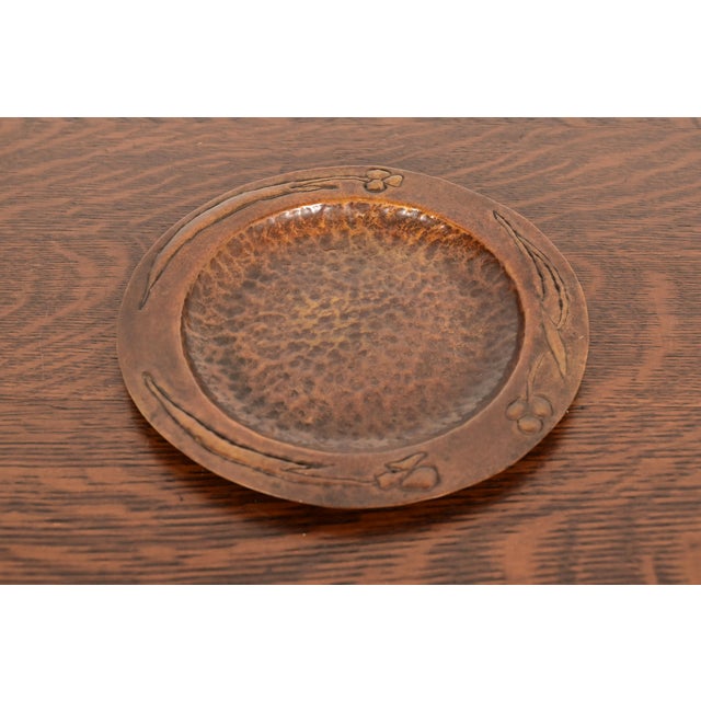 A gorgeous Arts & Crafts period hand hammered copper plate or tray In the manner of Roycroft USA, Circa 1910 Measures: 8"W...