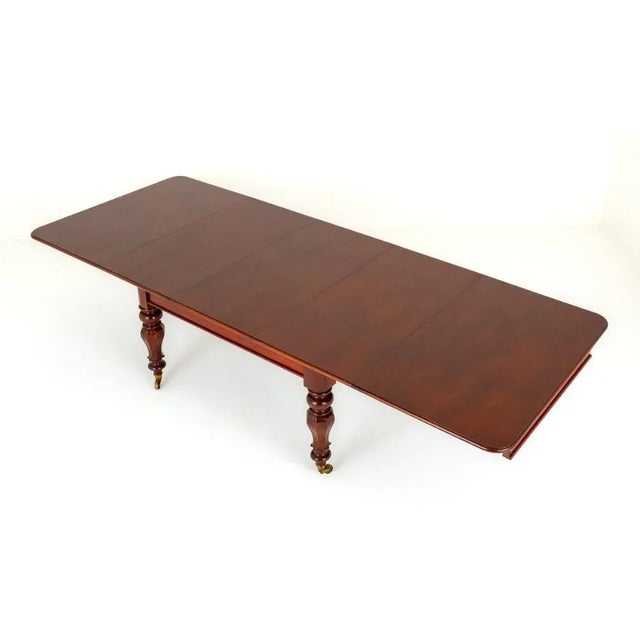 William IV mahogany Extending Dining Table. This Table is Raised upon Octagonal and Ring Turned Legs with Original Brass...