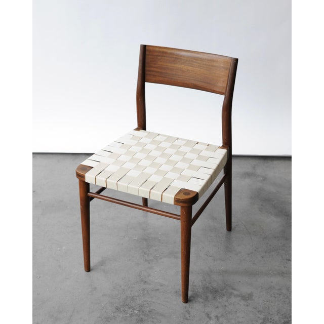 Model 351 chair by German designer Georg Leowald, 1950s. Features a solid teak frame and fabric seat. The wood has been...