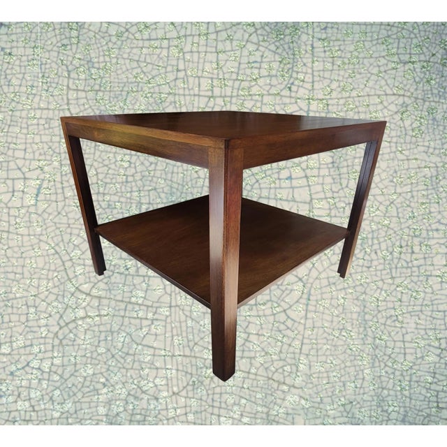 This Dunbar table by Edward Wormley is the ultimate in design. Its broad shelf, just 7-3/4" above the floor, appears to be...