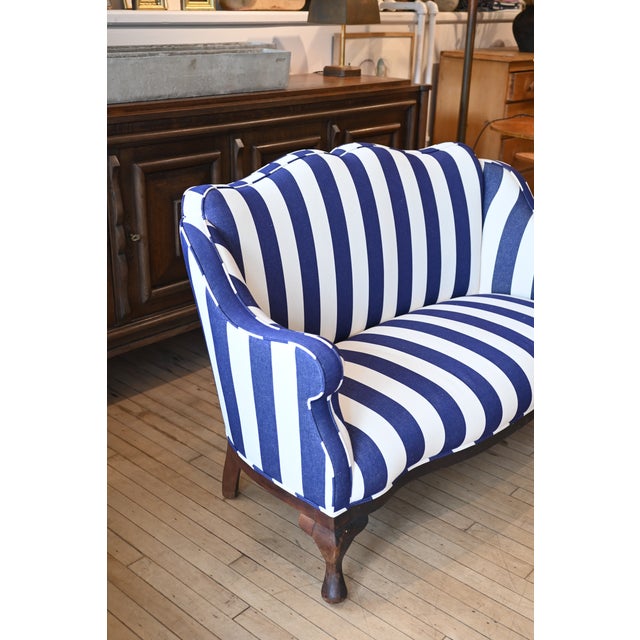 Make a statement with this turn of the century settee newly upholstered in bespoke Tuscany blue and white striped linen...