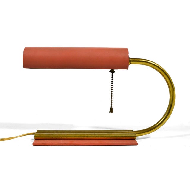 This elegant little desk lamp has an early midcentury or streamline moderne aesthetic in the manner of Gilbert Rohde. The...
