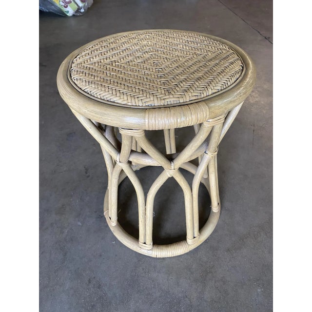 This beautifully restored 1970s Three-Stand Rattan Vanity Stool boasts a charming wicker seat and an eye-catching "X"...